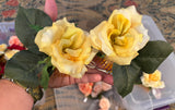 Matching pair of yellow Hair flowers on combs